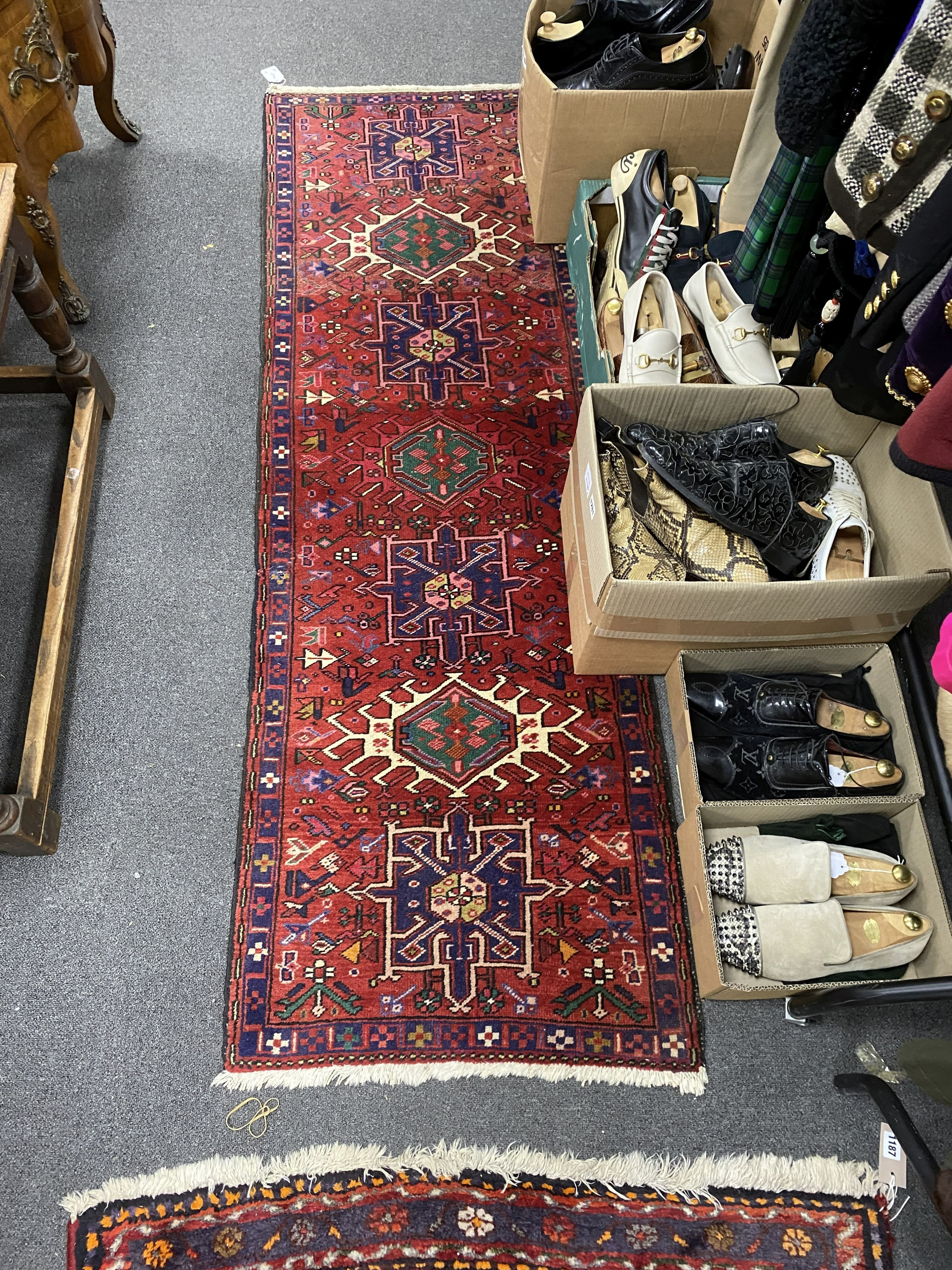 A Caucasian red ground rug, 160 x 100cm and similar runner